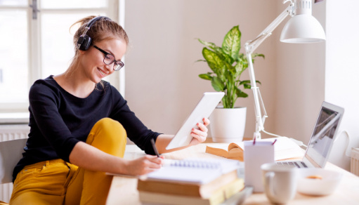 Young lady learning Spanish online from home