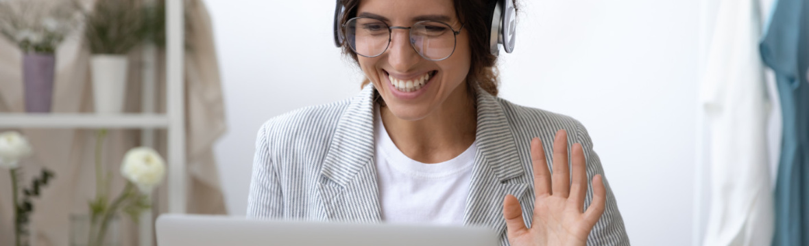 Executive woman taking online Spanish class from office